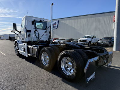 Truck chassis and cab of a 2026 Mack PR64T with dual rear axles, white cab, chrome wheels, and fifth-wheel hitch visible.