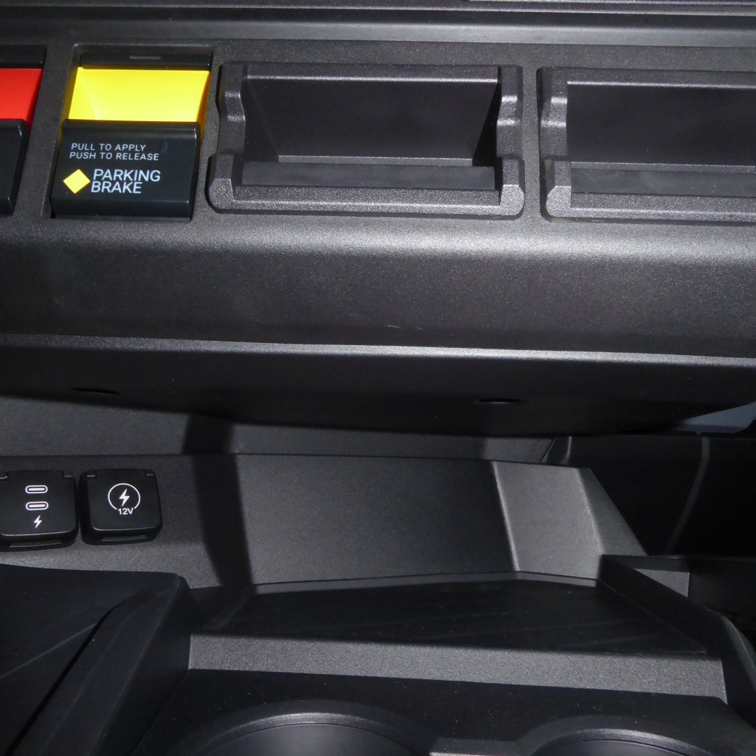 Dashboard area of a 2026 Mack PR64T tractor showing parking brake switch and ignition area.