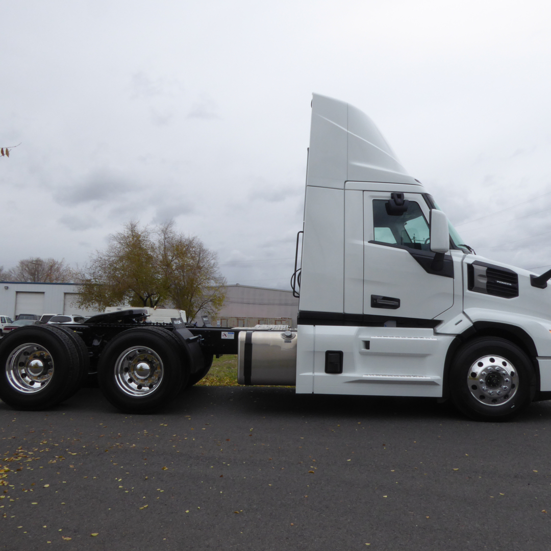 Mack PR64T conventional daycab tractor side view showing cab with sleeper and single rear axle, no trailer attached.