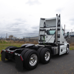 Mack PR64T truck rear/side view showing fifth wheel area and dual rear axles with chrome wheels.