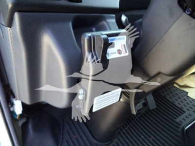 Isuzu NPR HD interior showing a badge/label on a switch panel with text and numbers visible.