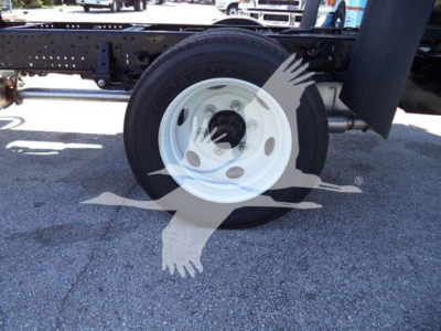 Isuzu NPR HD truck wheel and chassis showing white steel2014 style wheel with Goodyear tire and frame rails