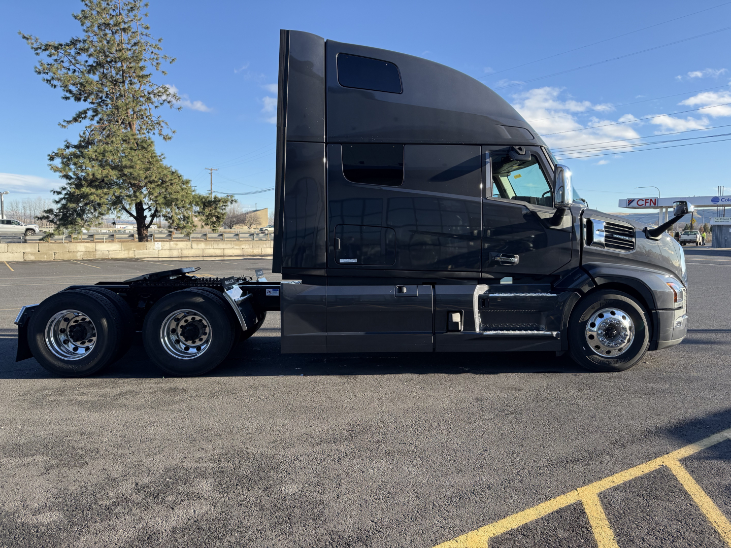 Mack PR64T76H conventional sleeper truck side view showing long hood and 6x4 configuration.