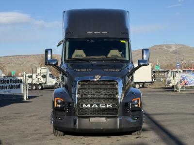 Front view of 2026 Mack PR64T76H sleeper cab truck showing grille with MACK lettering and large side mirrors.