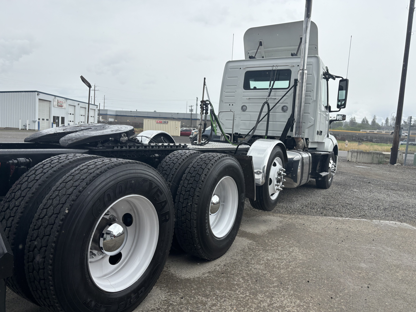 Volvo VNL84T300 daycab truck in-service showing side profile with tandem rear axles, dual rear tires, and sleeper cab.
