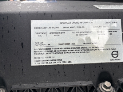 Engine information plate on Volvo VNL84T300 showing model D13M455, engine family JPH7L2GB01, serial number 120135, displacement 128 L, HP 455/1700, fuel rate 227 HP, exhaust rocker 1.0 mm, valve lash 0.2 mm, other specs and compliance notes