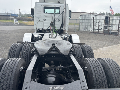 Volvo VNL Truck chassis showing rear undercarriage with dual rear axles and fifth-wheel area.