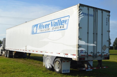 Trailer side and rear showing River Valley Trailer Leasing logo on a 2014 Utility 4000Dx trailer.