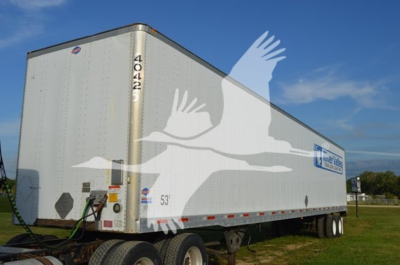 Trailer side view showing Utility 4000Dx utility trailer with 53' length and stock number 4042.