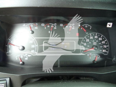 Dashboard view of a 2020 International MV truck showing analog gauges and a digital center display.