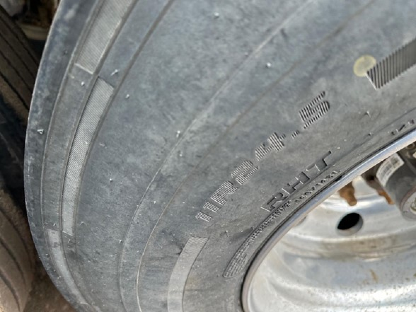Timpte hopper trailer tire and wheel assembly showing tread, sidewall text, and rim.