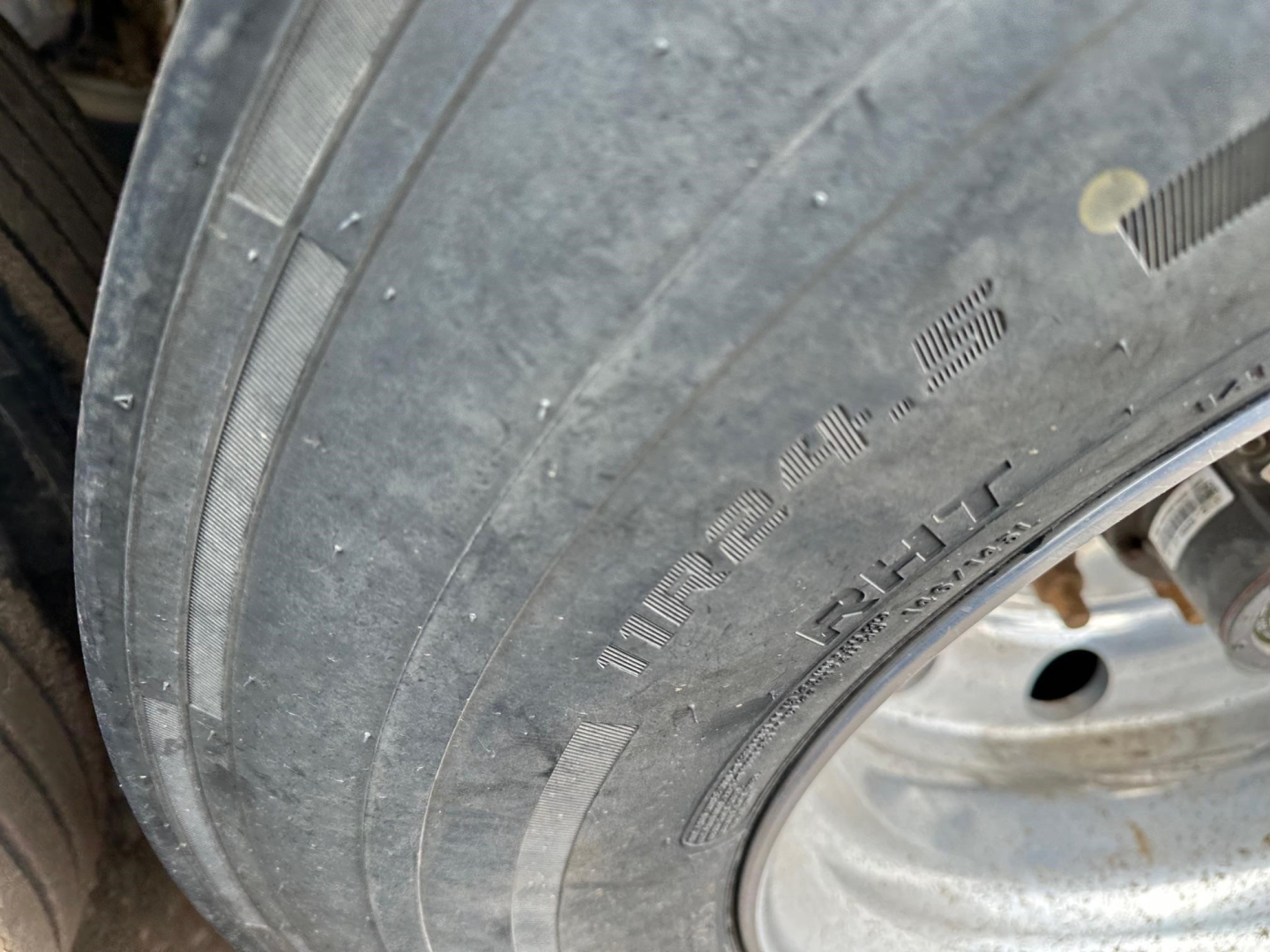 Tire sidewall with visible lettering; no other distinct components shown.