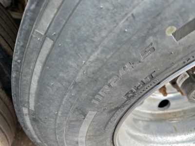 Timpte hopper trailer tire and wheel assembly showing tread, sidewall text, and rim.