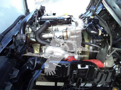 Engine bay of a 2020 Hino 195 refrigerated truck showing intake manifold, hoses, and turbo components.