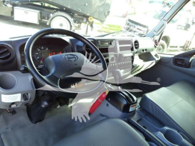 Interior of a 2020 Hino 195 refrigerated truck showing steering wheel, dashboard, and center console with a watermark overlay.