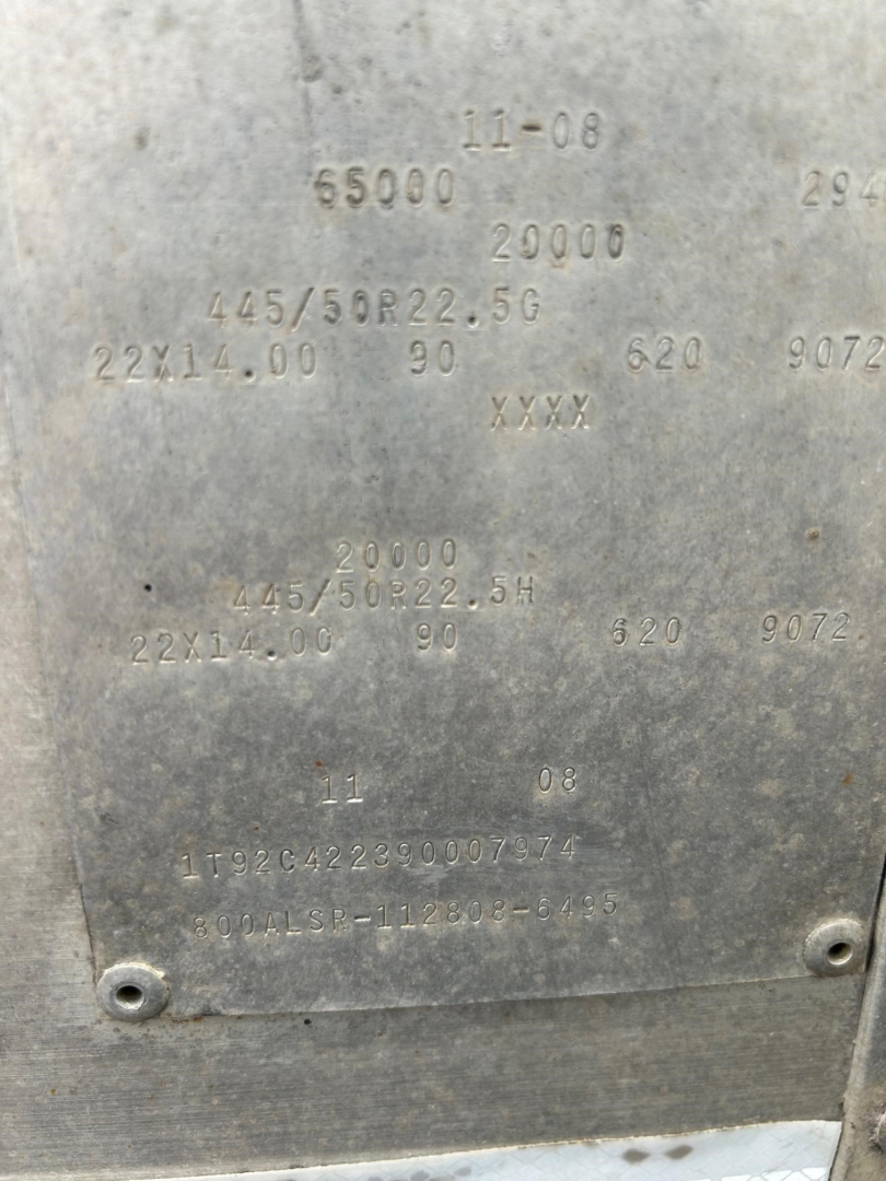 Metal hopper plate with stamped numbers and specs: 11-08, 65000, 20000, 145/50R22.5G, 22X14.00 90, 620, 9072, 11 08, 1192C...