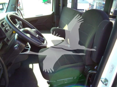 Truck interior showing steering wheel, driver's seat, and front passenger seat with watermark across image.