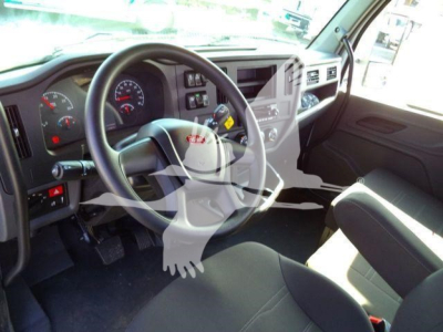 Peterbilt 536 truck interior view showing steering wheel, dashboard gauges, and front passenger seat.