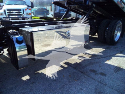 Peterbilt 536 rollback truck undercarriage showing rectangular metal tool/storage box and rear wheels.