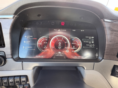 Peterbilt 579 dashboard display showing digital gauges and vehicle information.