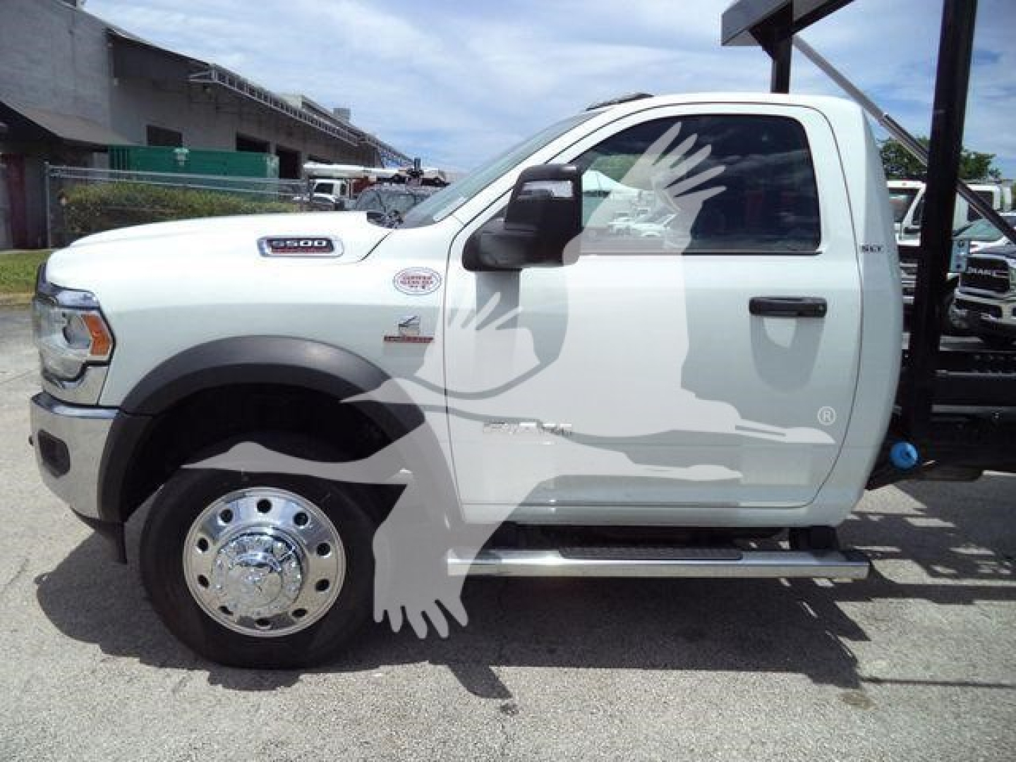 Ram 5500 cab in side profile showing front fender badge and door with step rail