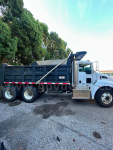 Kenworth T370 dump truck side view showing dump bed and cab with wheelbase, stock number 176-6671.