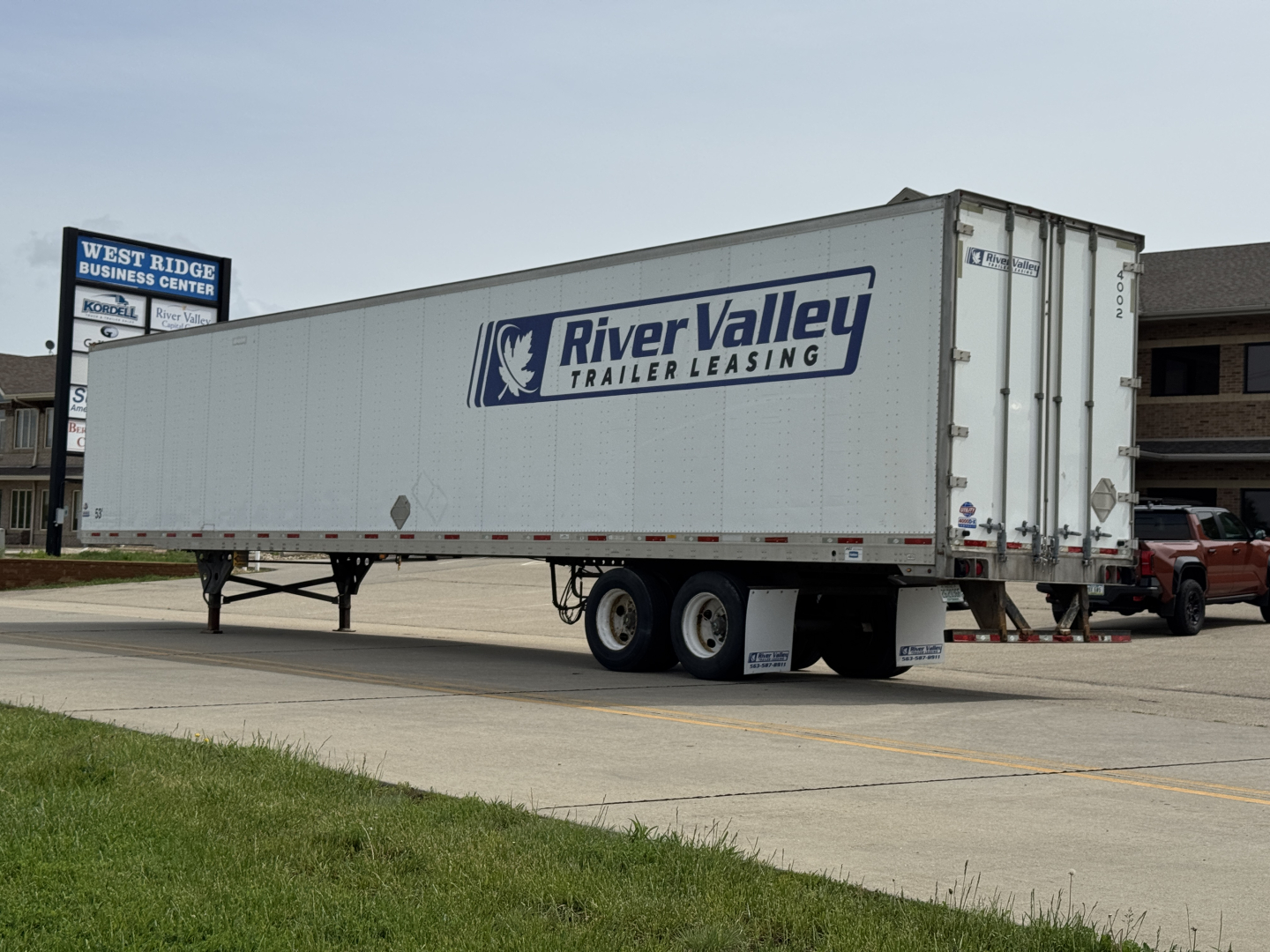 Trailer side view showing River Valley Trailer Leasing logo on a utility 4000Dx trailer.