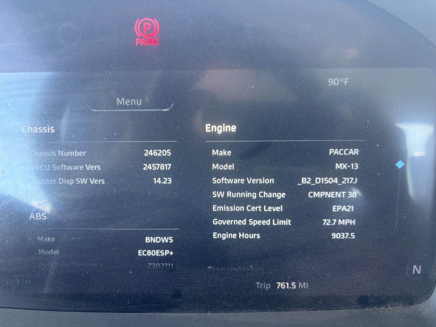 Engine display in Kenworth T680 showing Make PACCAR, Model MX-13, Software Version B2_D1504_217J, Emission Cert Level EPA1, Engine Hours 9037.5, GSL 72.7 MPH, Trip 761.5 MI, 90°F ambient, Vehicle chassis and ABS indicators