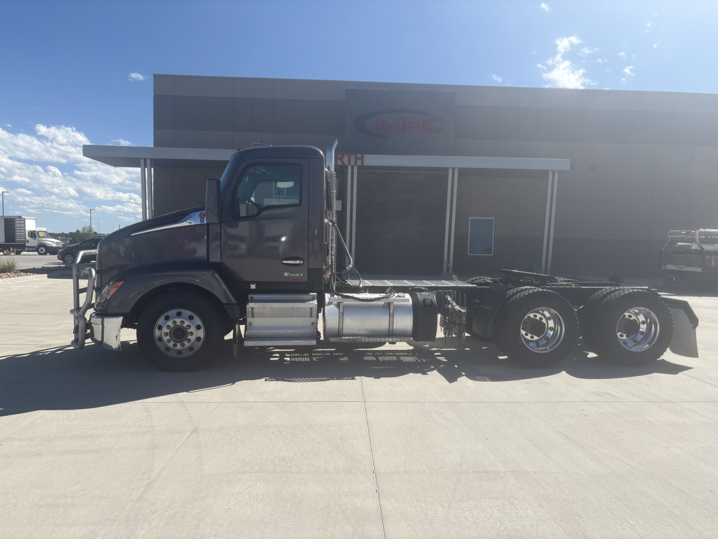 Kenworth T680 conventional daycab truck side view showing fuel tanks and chassis