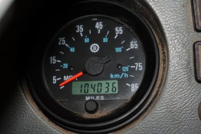 Mack RD688S dashboard/odometer showing speedometer up to 85 mph and digital odometer reading 104,036 miles.