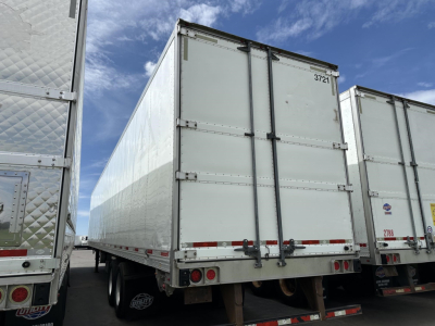 Trailer rear view of a 2015 Utility 3000R refrigerated trailer showing two rear doors and support wheels.