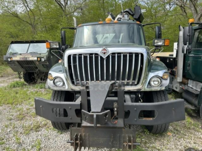 Front view of a 2012 International 7400 WorkStar dump truck showing a heavy front bumper and grille with International logo.