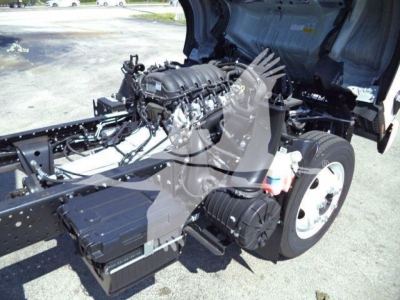Isuzu NPR-HD truck chassis with exposed engine and components visible in the engine bay