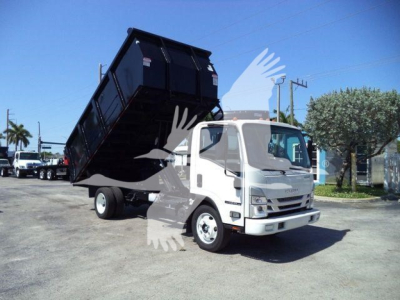 Isuzu NPR HD dump truck with dump bed raised, front cab visible, light gray/white cab and black dump bed.