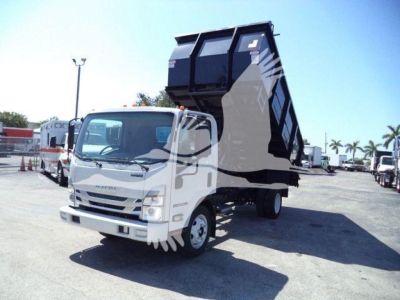Isuzu NPR-HD dump truck in a lot showing a raised black dump bed attached to a white cab.