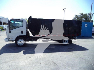 Isuzu NPR-HD truck side view with black dump bed, white cab, and stock number T15005FM visible in listing context.