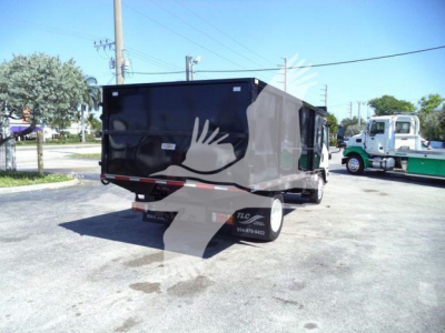Isuzu NPR-HD truck trailer shown from rear-side angle with black cargo bed and reflective bumper.