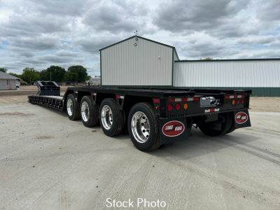 Load King 554 Quad gooseneck trailer with 9' wide loading deck and multiple axles, stock photo showing rear and side view.