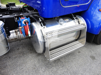 Truck side view showing chrome fuel tank and aluminum step assembly on a blue Peterbilt 337 chassis.