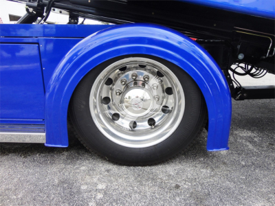 Peterbilt 337 rollback truck wheel and fender with blue paint and polished chrome wheel.