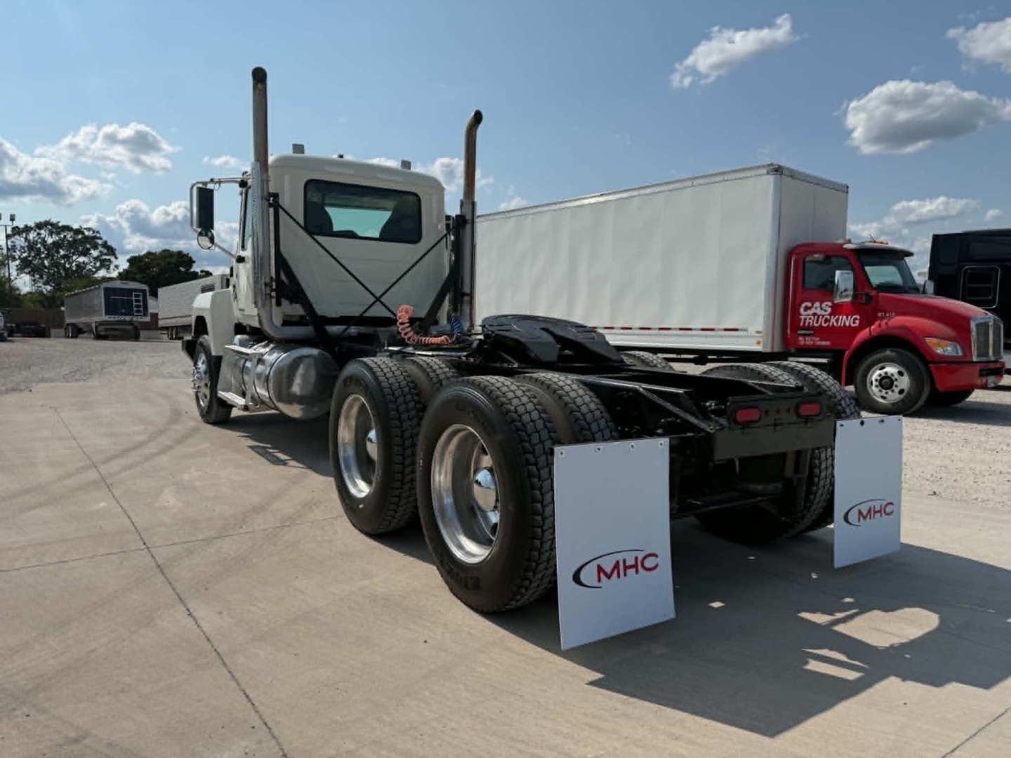 Truck chassis and rear view showing fifth-wheel area and dual rear axles on a 2019 Mack CHU613 conventional daycab.