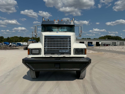 Front view of a 2019 Mack CHU613 truck showing large chrome grille and bumper, headlights, and side mirrors.