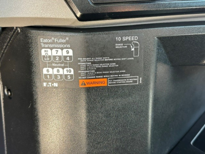 Truck interior label showing Eaton Fuller transmissions shift pattern with 10-speed configuration and warning text visible.