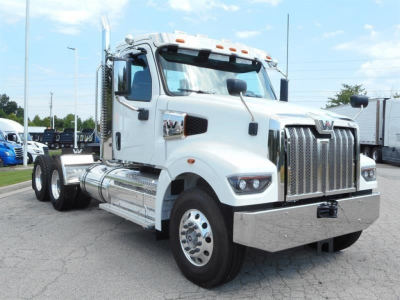 Western Star 49X Day Cab truck in white with chrome grille and heavy-duty bumper, front three-quarter view showing cab and chassis.
