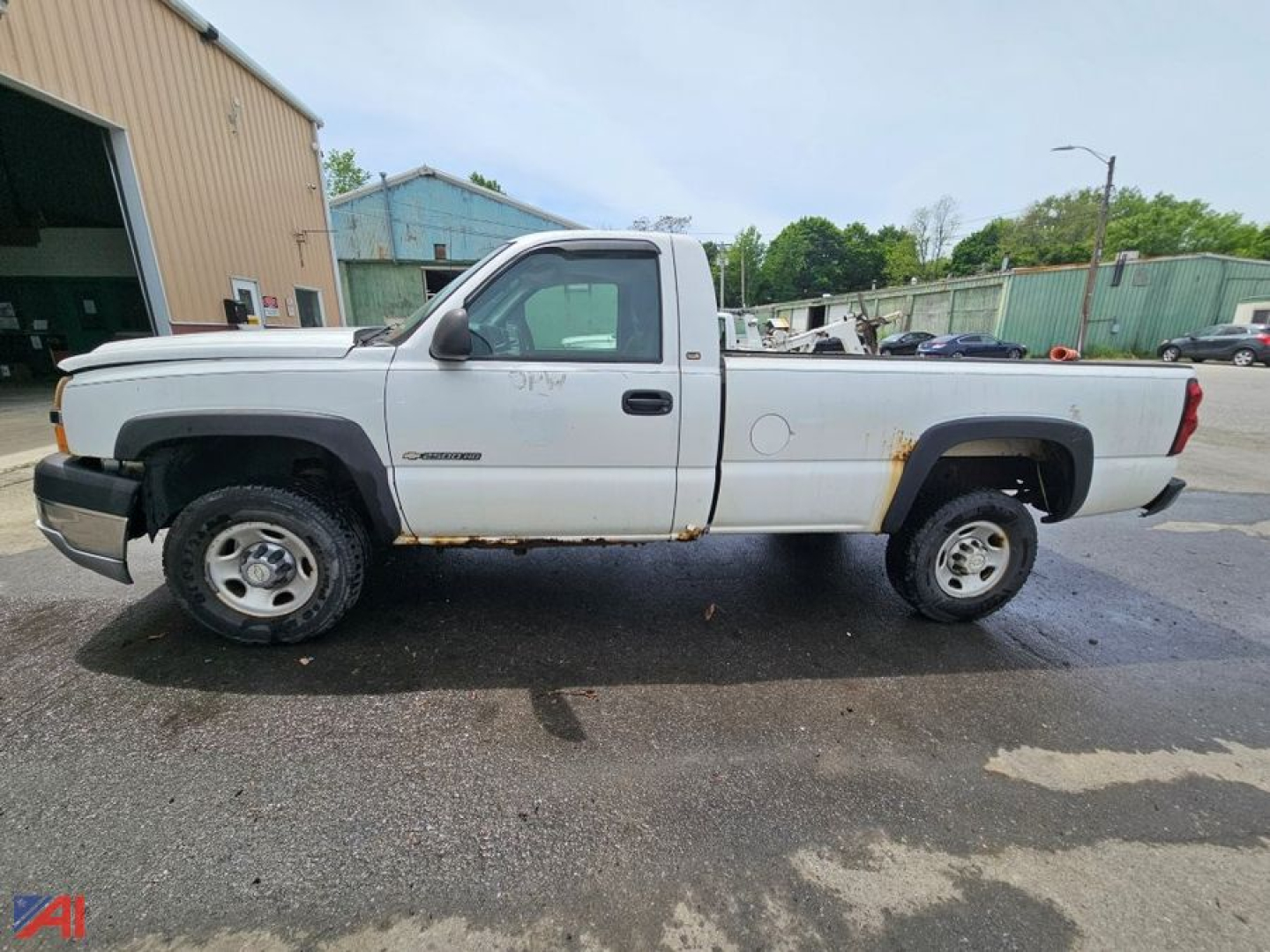 White 2005 Chevrolet Silverado 2500HD pickup truck in 2WD profile, single cab, long bed, with rust spots along lower body and wheel wells.