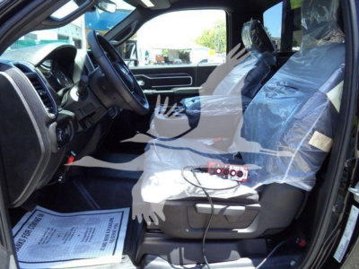 Ram 5500 interior view showing front seats and dashboard with protective plastic on seats.