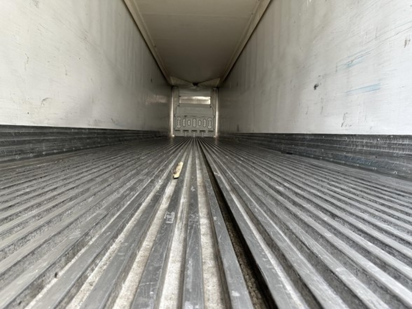 Trailer interior cargo area of a 2017 Great Dane S-600 reefer trailer showing ribbed steel floor and rear door edge.