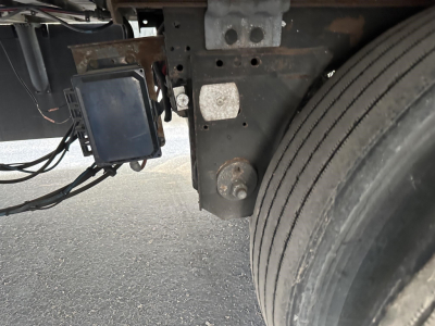 Great Dane air ride reefer trailer undercarriage showing control module and suspension mounting near the wheel.