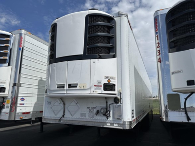 Great Dane S-600 trailer rear view showing refrigeration unit and bumper with markings in a row of trailers.