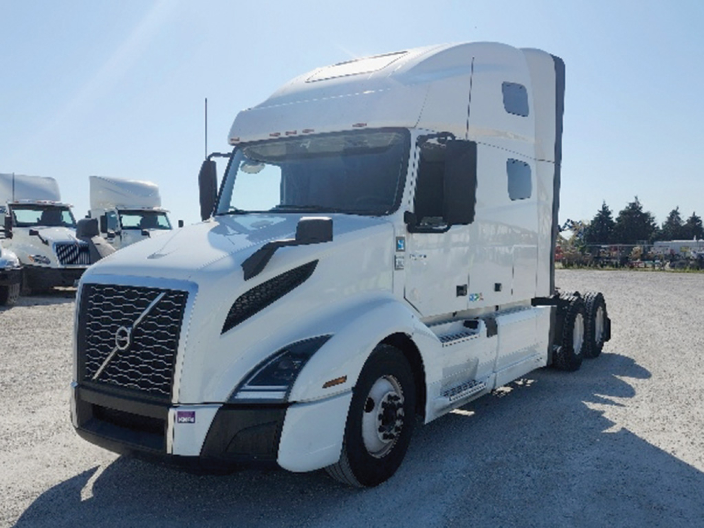 Volvo VNL 760 sleeper tractor in white, front-left view showing grille, headlights, and aerodynamic design.